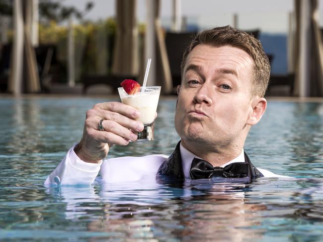 Gold Logie chance Grant Denyer takes a dip in his finest suit on the Gold Coast ahead of the Logies. Picture: Nigel Hallett