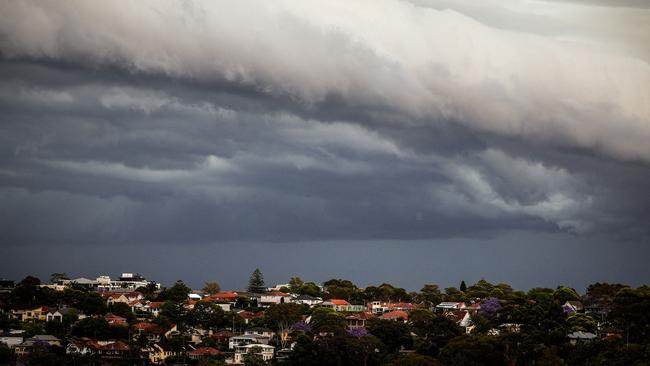 Storm clouds move over houses in northern Sydney on November 9, 2023. (Photo by DAVID GRAY / AFP)