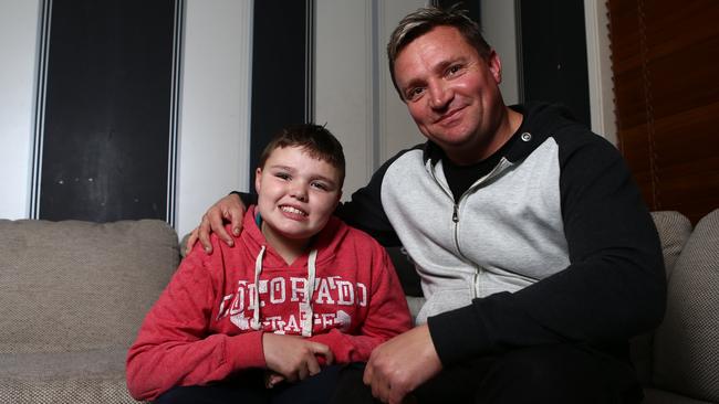 Layton and father Troy at home. Picture: Tim Hunter