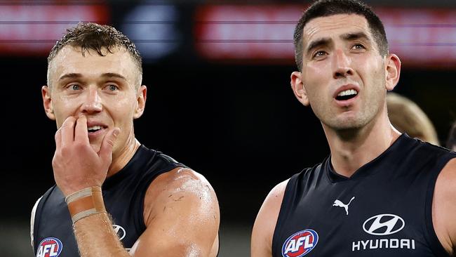 MELBOURNE, AUSTRALIA - MARCH 20: Patrick Cripps (left) and Jacob Weitering of the Blues look dejected after a loss during the 2025 AFL Round 02 match between the Carlton Blues and the Hawthorn Hawks at the Melbourne Cricket Ground on March 20, 2025 in Melbourne, Australia. (Photo by Michael Willson/AFL Photos via Getty Images)