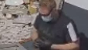 The second suspect had black sunglasses and a blue mask on, a black shirt with shite stripes on the sleeve and brown work pants. Image: supplied.