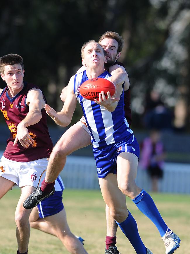 Action in the QAFL match between Mt Gravatt and Palm Beach. Saturday June 12, 2021. Picture, Joh Gass