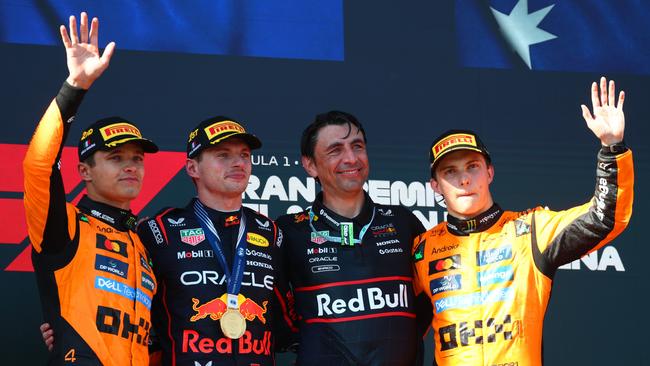 Lando Norris, race winner Max Verstappen and Oscar Piastri on the podium in Imola. (Photo by Clive Rose/Getty Images)