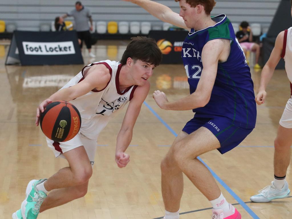 Basketball Australia Schools Championships at Carrara. Mens open final, Lake Ginninderra College Lakers V TSS (in white). the Lakers defence gave Benjamin Tweedy from TSS special attention in the final. Picture Glenn Hampson