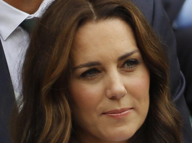 Kate, the Duchess of Cambridge sits in front of former Swedish tennis player Stefan Edberg in the Royal Box ahead of the Men's Singles final match between Switzerland's Roger Federer and Croatia's Marin Cilic on day thirteen at the Wimbledon Tennis Championships in London Sunday, July 16, 2017. (AP Photo/Alastair Grant)