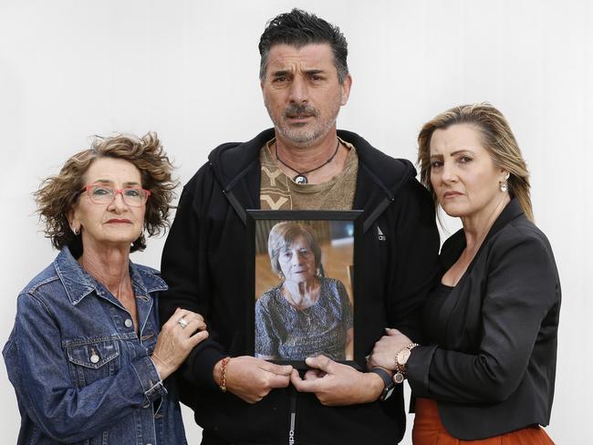 Joyce Byrne, Mark Galea holding picture of his mum Stella Galea, 89, and Joan Miranda. Picture: David Caird