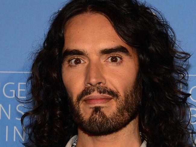 (FILES) Actor Russell Brand poses on arrival with director David Lynch (not pictured) to launch âMeditation in Educationâ, a Global Outreach campaign to teach 1,000,000 at-risk youth "Meditation in Education" on April 2, 2013 in Los Angeles, California. British comedian and actor Russell Brand has been accused by an unnamed actress of sexually assaulting her during the filming of the film "Arthur" in 2010 in New York, according to court documents revealed on November 3, 2023. (Photo by Frederic J. BROWN / AFP)