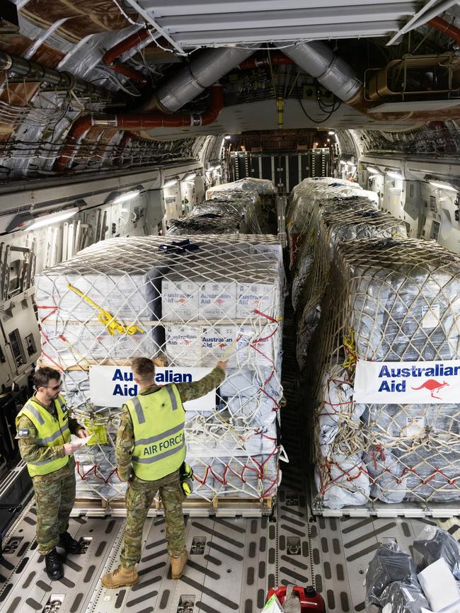 Back in Australia, Air Load Team members from No 23 Squadron perform final checks on a C-17A Globemaster III at RAAF Base Amberley before it departs. Picture: ADF.