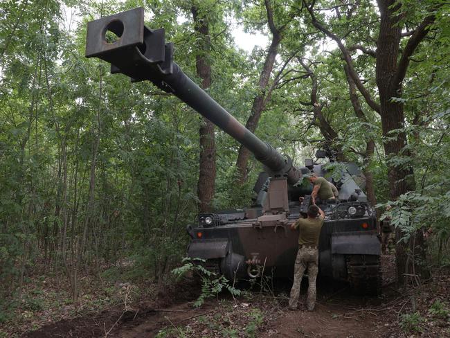 Ukrainian servicemen work next to a Polish 155mm self-propelled tracked gun-howitzer Krab at a position on the front line in the Donetsk region in July, 2022, amid Russian invasion of Ukraine. Picture: AFP