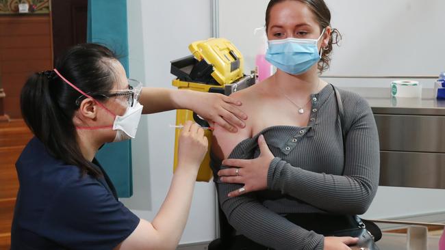 Royal Children’s Hospital ICU nurse Abbey Gallop receives her booster vaccination. Picture: David Crosling