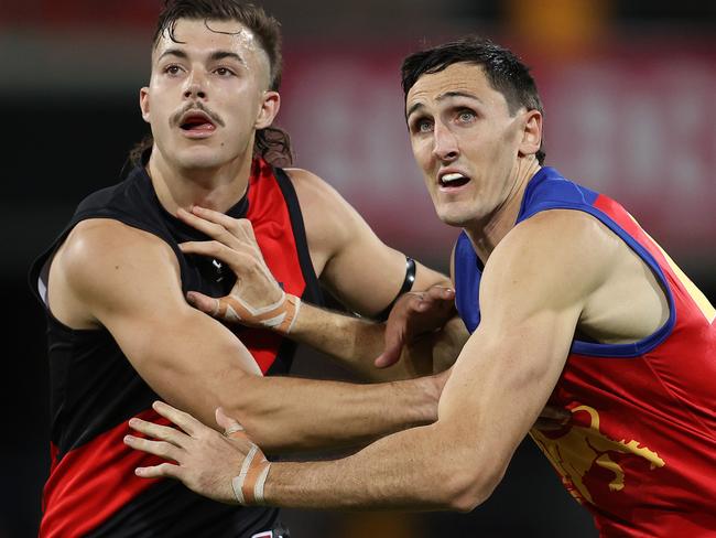 AFL Round 9. Essendon vs Brisbane at Metricon Stadium, Gold Coast.  31/07/2020.    Sam Draper of the Bombers battles with Oscar McInerney of the Lions q1   . Pic: Michael Klein