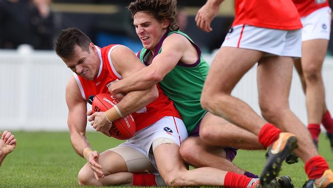 Matty Holmes is tackled by Kyle Mahony. Picture: Josie Hayden