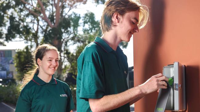 ADV COMMERCIAL Mobile Phone BanBlackwood High School students Emily Bryant yr 8 and Angus Dodd yr11, locking their phone pouches  during school hours.IMAGE/Russell Millard