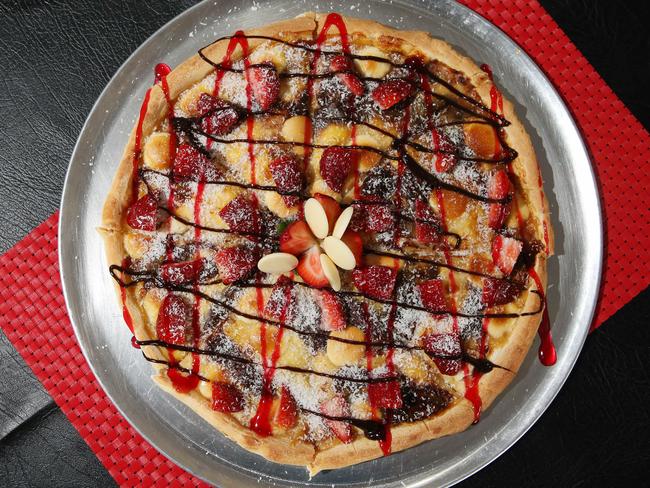 The Valentino dessert pizza, Nutella base, custard, white chocolate button, fresh strawberries, coconut and chocolate fudge. Picture by Scott Fletcher