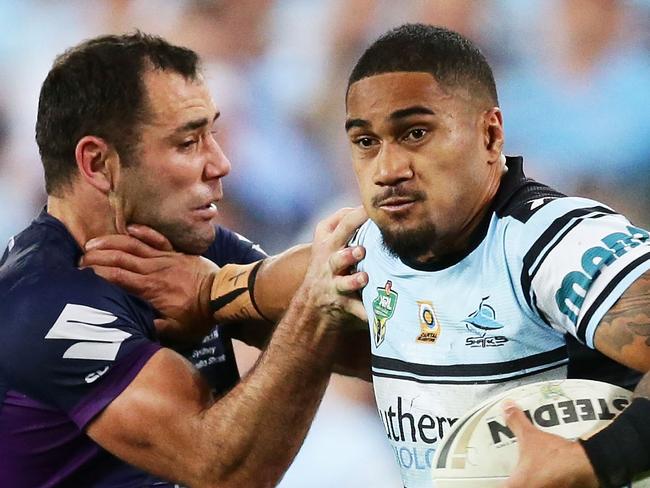 SYDNEY, AUSTRALIA - OCTOBER 02:  Ricky Leutele of the Sharks puts a fend on Cameron Smith of the Storm during the 2016 NRL Grand Final match between the Cronulla Sharks and the Melbourne Storm at ANZ Stadium on October 2, 2016 in Sydney, Australia.  (Photo by Matt King/Getty Images)