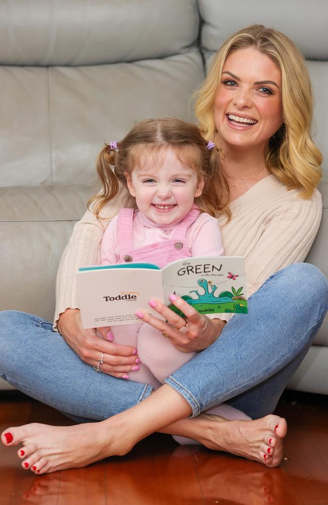 Erin Molan and daughter Eliza love reading together. Picture: Justin Lloyd