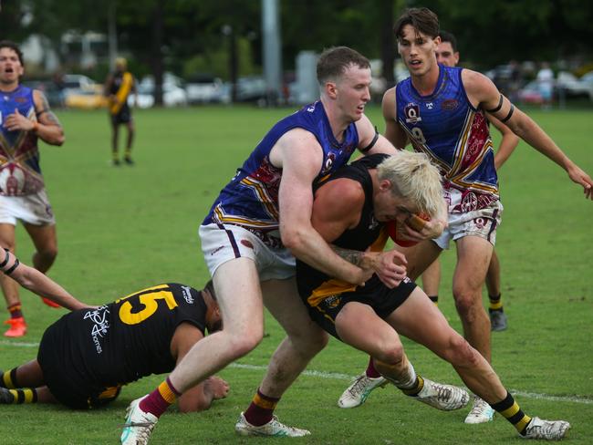 Pictured: Nicholas Johnson tackles Ben Deluca. North Cairns Tigers v Cairns City Lions, Round 11 at Watsons Oval. AFL Cairns 2024. Photo: Gyan-Reece Rocha