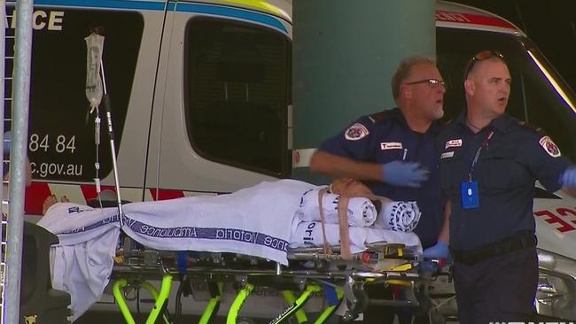 The woman is raced to hospital after the attack. Picture: Nine News