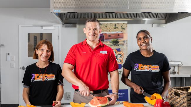 Purple House CEO Sarah Brown, Coles Regional Manager Daniel Clegg and Purple House team member Chloe Dodd