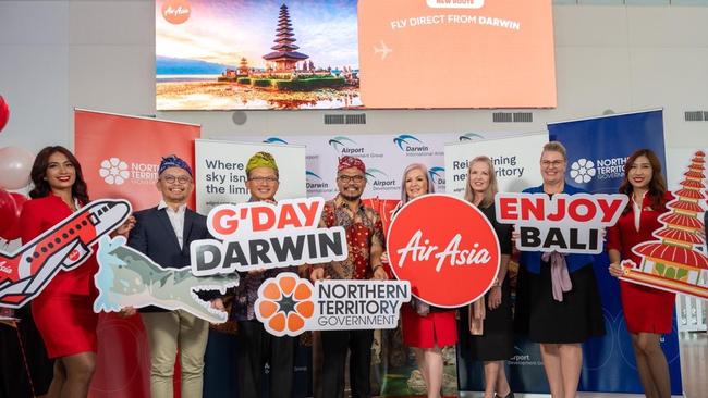 NT Government ministers Robyn Cahill (fourth from right) and Marie-Clare Boothby (second from right) flank Airport Development Group executive general manager Sandra de Kock alongside Captain Captain Akhmad Mauzana and other airline executives. Picture: Julianne Osbourne.