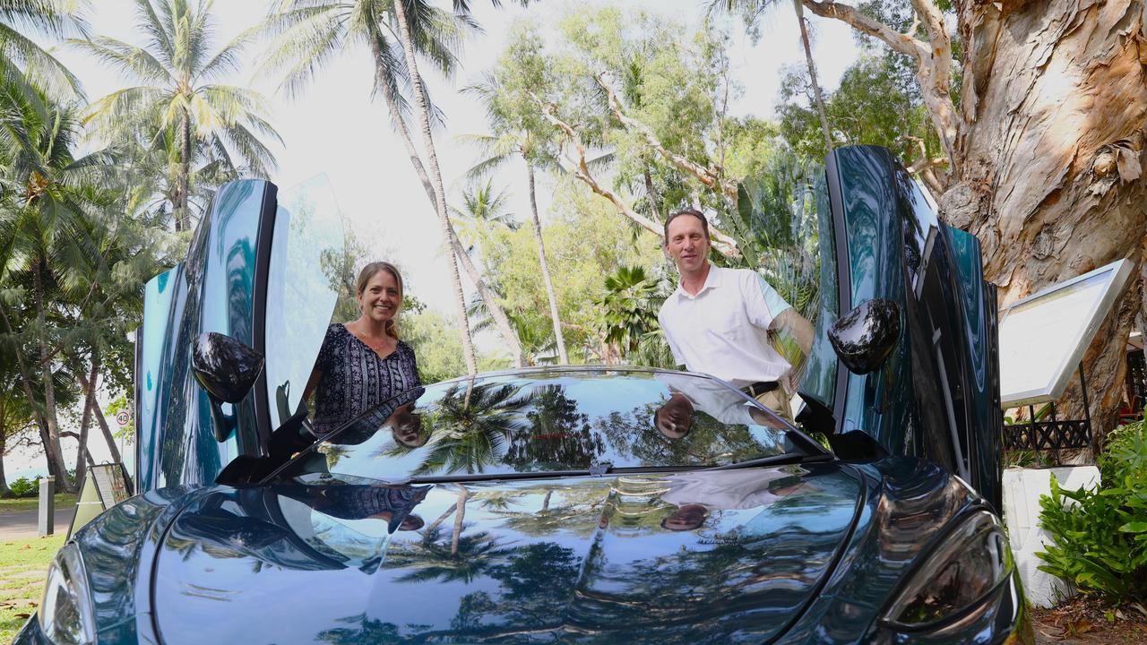 Prancing Horse representative Jessie Bibbo and Reef House general manager Wayne Harris in a McLaren GT in Palm Cove. Picture: Elodie Jakes