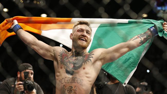 Conor McGregor reacts after defeating Jose Aldo during a featherweight championship mixed martial arts bout at UFC 194, Saturday, Dec. 12, 2015, in Las Vegas. (AP Photo/John Locher)