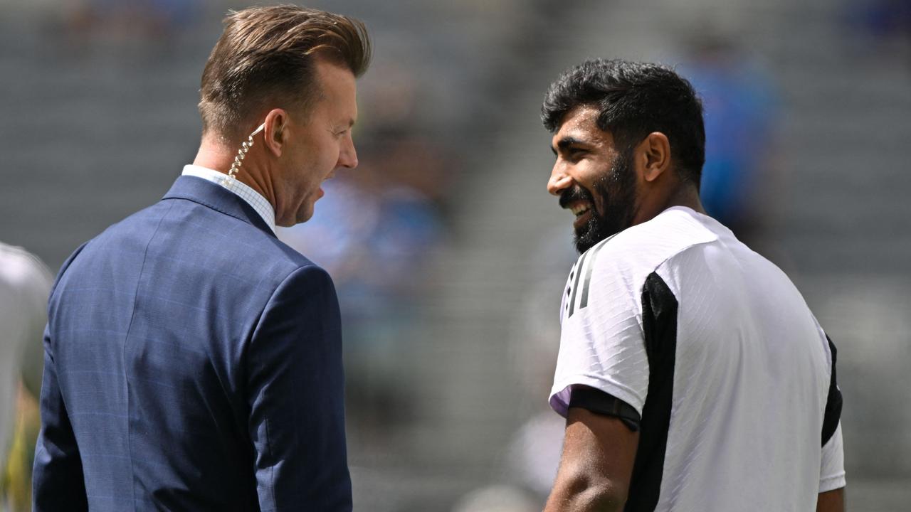 India’s Jasprit Bumrah talks with Australia’s former cricketer Brett Lee during the first Test in Perth. (Photo by SAEED KHAN / AFP)