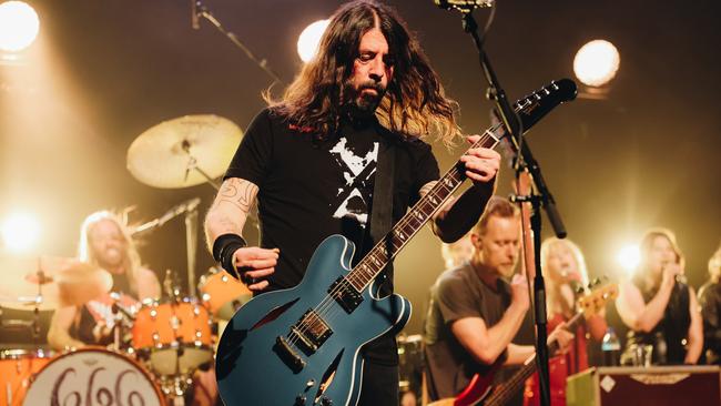 Taylor Hawkins, Dave Grohl and Nate Mendel of Foo Fighters perform at the after-party for the Los Angeles premiere of Studio 666. Picture: Getty Images