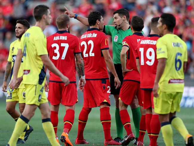 Ersan Gulum gets in the ref’s face.