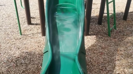 A slide melts in the heat at a playground near Coburg Lake. Photo: Supplied