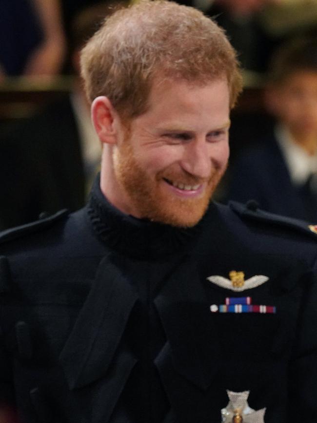 Prince Harry had a wide smile when he saw his bride. Picture: AP