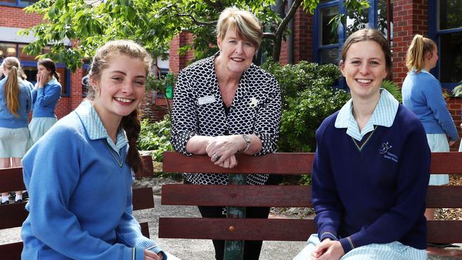 Mater Christi College principal Mary Fitz-Gerald with students Lauren Baker, left, and Sophie Clarke yesterday. Picture: Aaron Francis