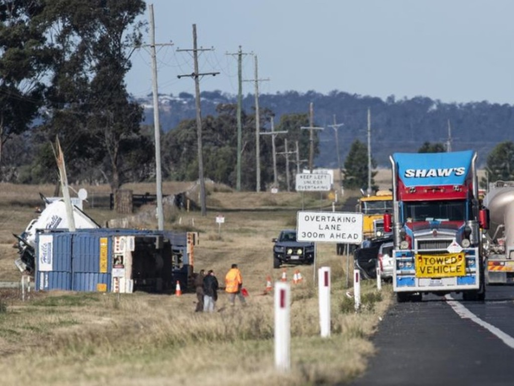 Emergency services at the scene of the fatal crash on the Warrego Highway, east of Oakey, Sunday, June 9, 2024. Picture: Kevin Farmer