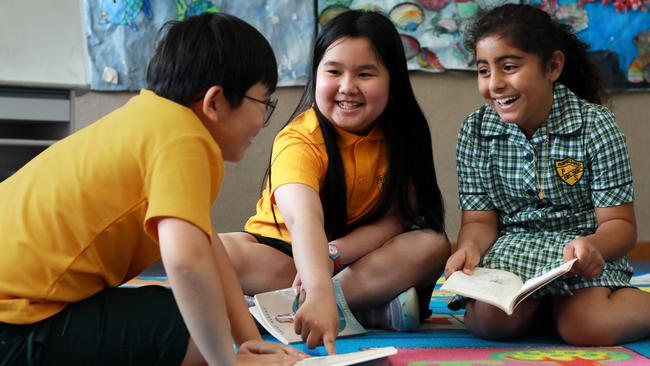 Sydney’s Fairfield West Public School pupils Brendon Nguyen, Jennifer Doan and Rochelle Aslani, all 9. have improved their reading skills over time with NAPLAN. Picture: Jane Dempster