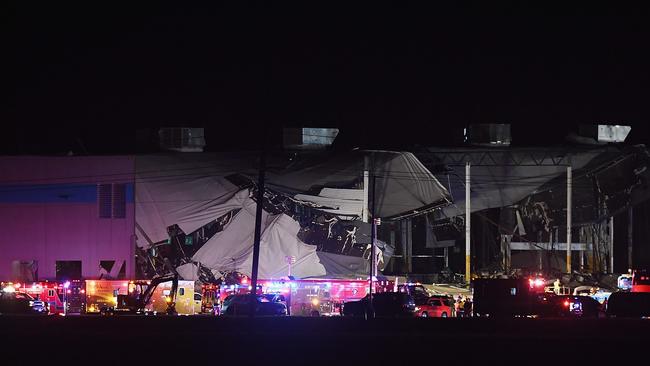 First responders surround a damaged Amazon warehouse. Picture: Getty