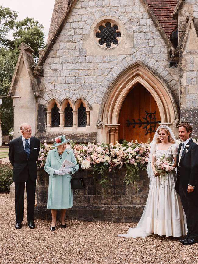 The bride and groom with the Queen and Prince Philip. Picture: Benjamin Wheeler/Getty Images