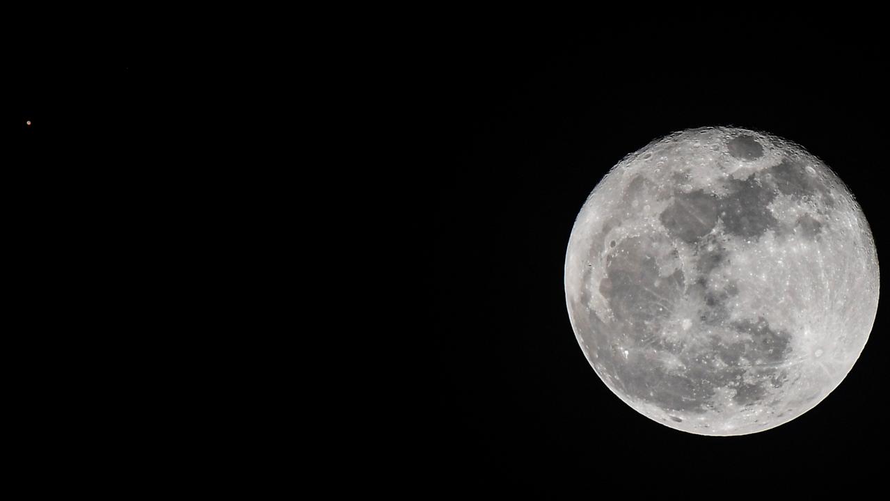 A view of Mars next to the moon (Mars is the almost imperceptible dot to the left of the image). Picture: Luis Acosta/AFP