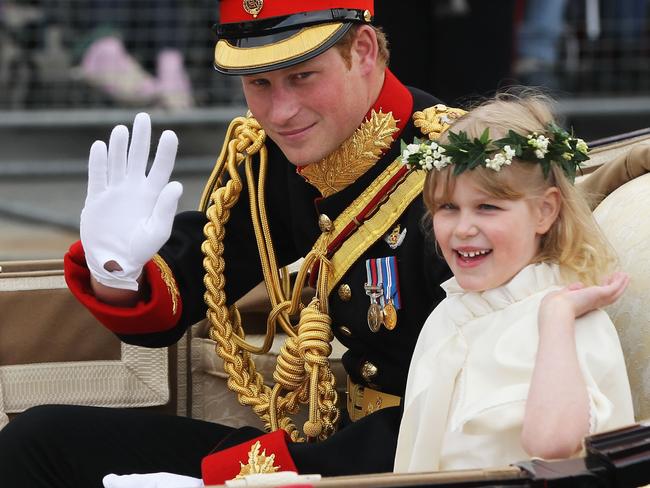 Prince Harry and Lady Louise Windsor ride in a carriage procession to Buckingham Palace following the marriage William and Kate. Picture: Sean Gallup/Getty Images