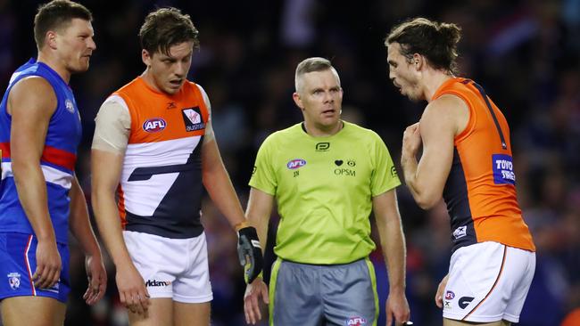 Phil Davis reacts after being struck by Jack Redpath. Picture: Michael Klein