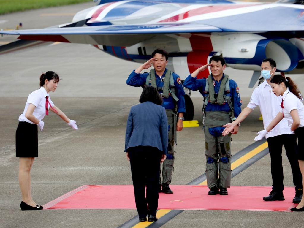 Tsai Ing-wen bows to test pilots for the ‘Brave Eagle’ Advanced Jet Trainer. Picture: Hsu Tsun-hsu/AFP