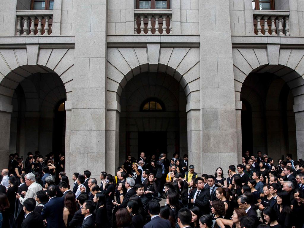 Legal professionals march to the Central Government Offices in Hong Kong to protest against the Government's plans to approve extraditions with mainland China, Taiwan and Macau. Picture: Isaac Lawrence/AFP