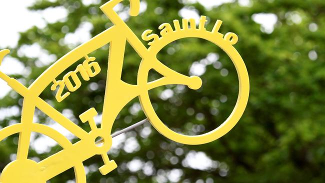 A placard shaped as a bike reads in Saint-Lo, Normandy, ahead of 103rd edition of the Tour de France.