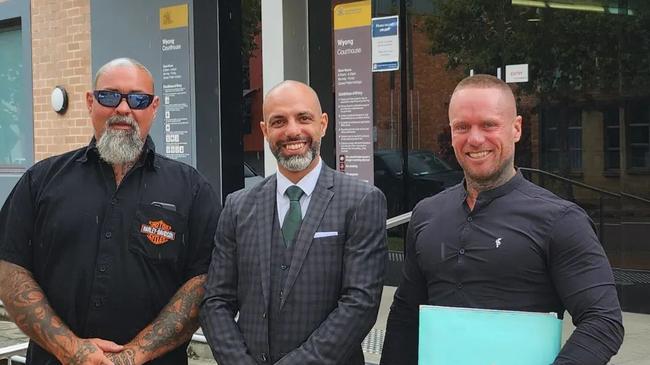 Bandidos member Joshua Hugh Deane, 38, of The Entrance North, (right) with his lawyer Anthony Tashman (middle) and another man (left) outside Wyong Local Court. The photo was posted on Tashman Lawyers' Facebook page after Deane's robbery in company charge was withdrawn. Picture: Facebook