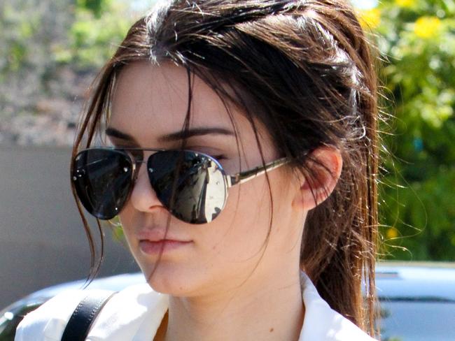 UK CLIENTS MUST CREDIT: AKM-GSI ONLY Kendall Jenner wears a revealing plunging top, as she steps out with a friend this afternoon in West Hollywood. The reality star turn model let it all hang out, as she hung with a friend on a hot day in L.A. Pictured: Kendall Jenner Ref: SPL1079194 140715 Picture by: AKM-GSI / Splash News