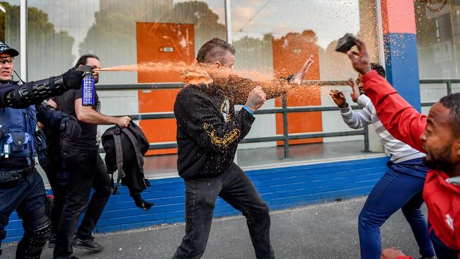 Police were forced to use capsicum spray on violent protesters. Picture: Jake Nowakowski