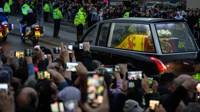 The coffin of Queen Elizabeth II leaves RAF Northolt, west London.