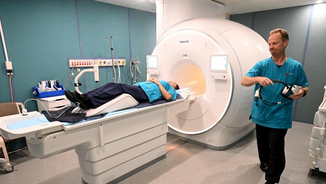 Operators Nikki De Leon and Ian Reynolds demonstrate a new next generation Ingenia Ambition 1.5T MRI machine at Nepean Hospital. Picture: AAP/Joel Carrett.