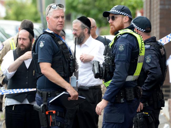 Police and fire investigators outside the Adass Israel synagogue at Ripponlea. Picture: Andrew Henshaw