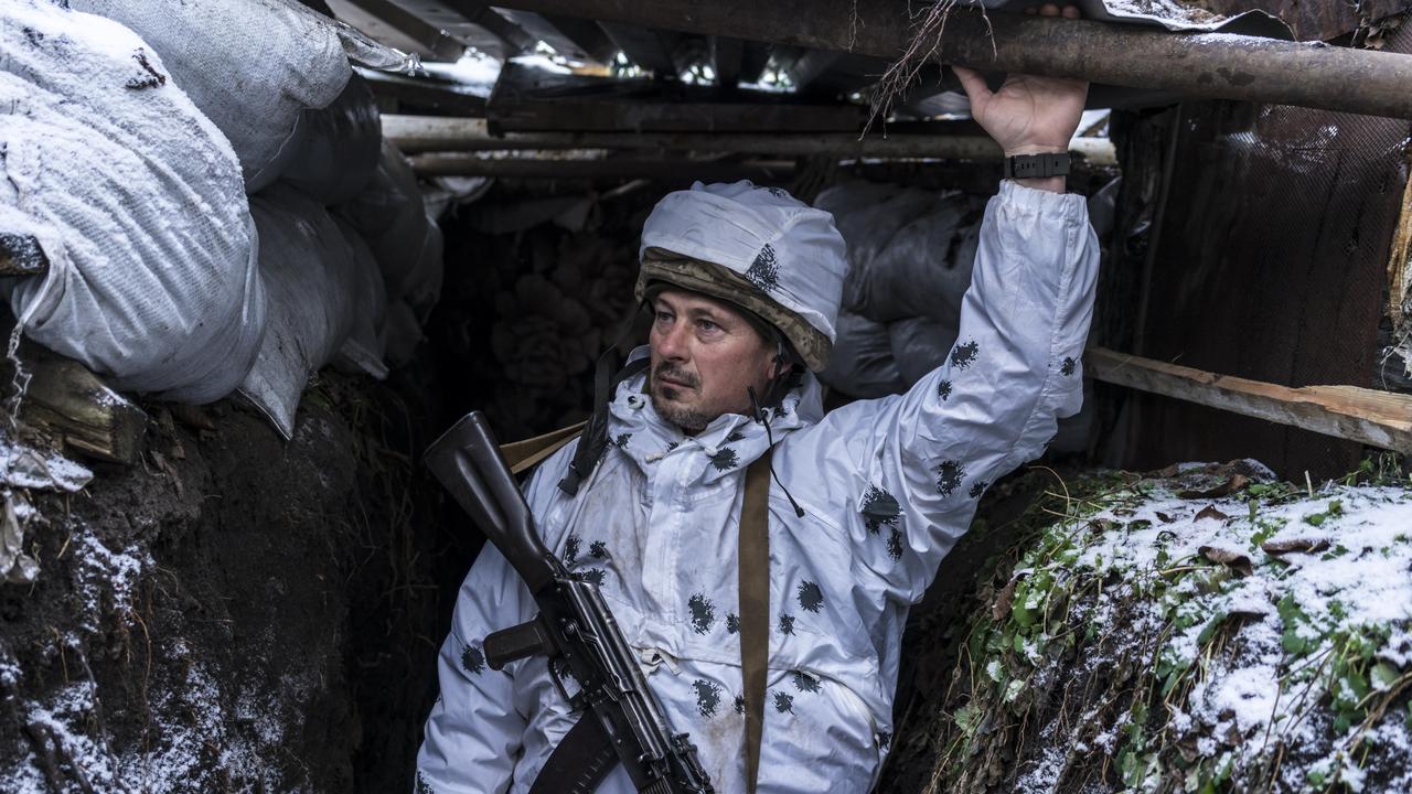 A Ukrainian soldier with the 56th Brigade, poses for a portrait in a trench on the front line on January 18, 2022 in Pisky, Ukraine. Picture: Brendan Hoffman/Getty Images.