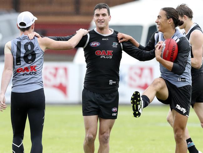 AFL - Port Adelaide training at Alberton Oval. Tom Rockliff with Zac Butters and Kai Pudney. Picture SARAH REED